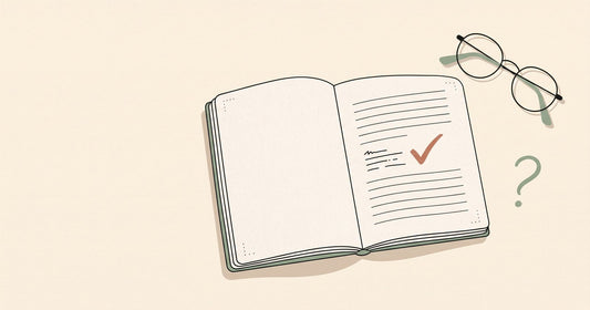 Illustration of an open journal page with a checkmark, a pair of glasses, and a question mark